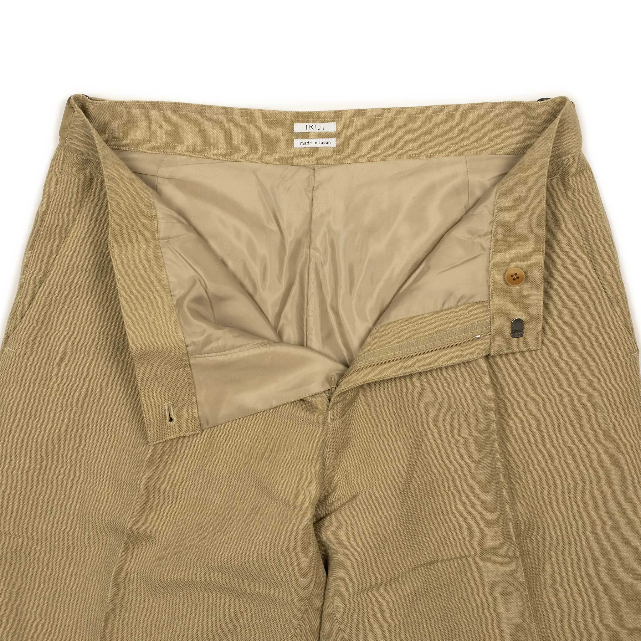 Side tab pleated trousers in camel color soft wool and linen oxford